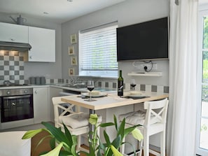 Tastefully modernised kitchen area with breakfast bar | Petit Knowle - Knowle Lodge, Cuckfield, near Haywards Heath