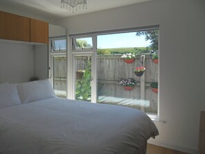 Comfortable double bedroom | Chalet One, Bridport