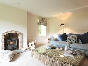 Cosy living room with wood burner | Garden Cottage, Settrington, near Malton