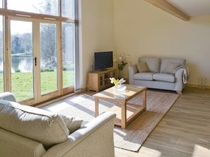 Delightful lounge area in open plan living space | Orchid Lodge - Springwater Lakes, Hainford, near Norwich