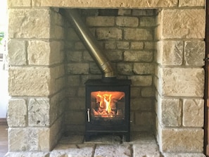 Cosy wood burning stove in the living room | Orchard House, Chipping Campden