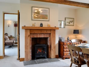 Dining area with feature fireplace | Farm Cottage - Springfield Farm Cottages, Bigrigg, near Egremont