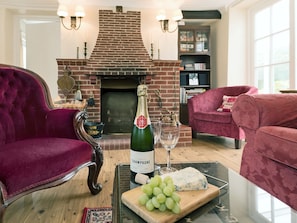 Cosy living area with open fire | Church Cottage, Denford, near Thrapston