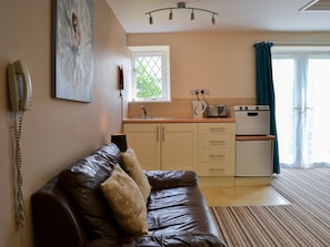 Delightful open plan living area with compact kitchen area | Lee Studio - Trimstone Manor Cottages, Trimstone, near Woolacombe