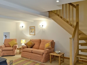 Cosy lounge with access to stairs to upper level | Honey Cottage - Bramble Cottage and Honey Cottage, Newland, near Coleford