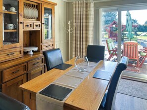 Dining Area and view of the gardens from Leanda Lodge | Leanda Lodge, Burgh Castle, near Great Yarmouth