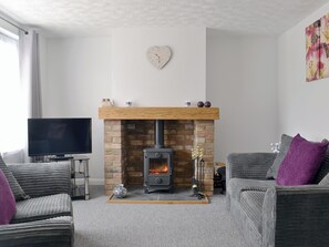 Cosy living room with wood burner | Banovallum Cottage, Horncastle