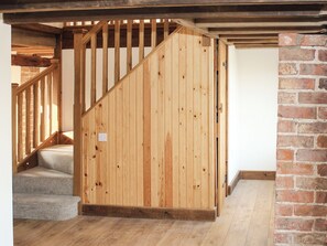 Hallway with flag floor and exposed brick and woodwork | The Cart Shed - Corporation Farm Cottages, Tickton, near Beverley