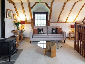 Living room with wood burner | Fochy Cottage - Waulkmill Cottages, Kinross, near Perth