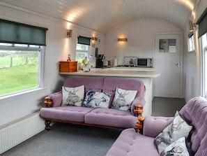 Living area with comfortable and cosy seats | The Carriage, Bridge of Dee, near Castle Douglas