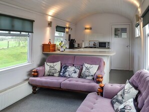 Living area with comfortable and cosy seats | The Carriage, Bridge of Dee, near Castle Douglas