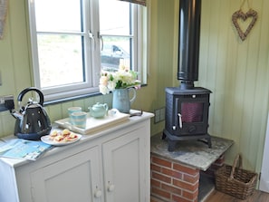 Cosy living area with wood burner | The Wool Shed, Gorran, near St Austell