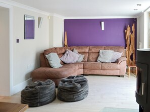 Living room with wood burner | Riverside, Bude