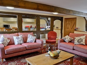 Living room with exposed wood beams | Mill Cottage, Peterchurch, near Hay-on-Wye