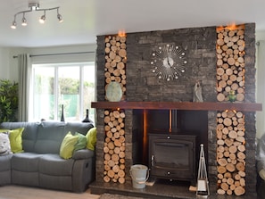 Impressive fireplace with wood burning fire | Hillcrest House, Brown Edge, near Leek