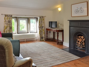 Spacious and warming living/dining room with open fireplace | Pear Tree House Annexe, Wooldale, near Holmfirth