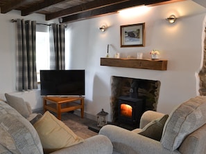 Open plan living space with wood burner | Ty Bobbet, Penysarn