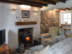 Open plan living space with wood burner | Ty Bobbet, Penysarn