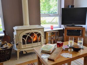 Spacious living and dining room with wood burner | Tre Anna Lodge, Dwyran, near Llanfairpwllgwyngyll