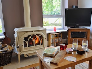 Spacious living and dining room with wood burner | Tre Anna Lodge, Dwyran, near Llanfairpwllgwyngyll