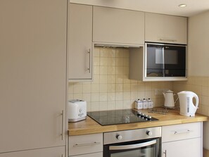 Open plan contemporary style kitchen and diner | Anchor Cottage, Deal