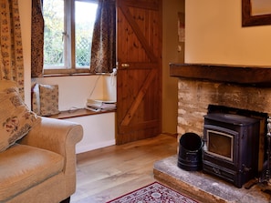 Delightful living room with feature fireplace | The Cot, Bussage, near Cirencester