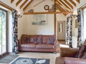 Characterful living room with exposed wood beams | The Cotes, Upper Welland, near Malvern