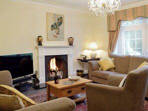 The impressive and spacious living room with large picture windows to take in the magnificent surroundings | Tan Y Castell, Llanmill, near Narberth