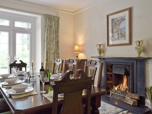 Formal dining room with French doors to garden | Tan Y Castell, Llanmill, near Narberth