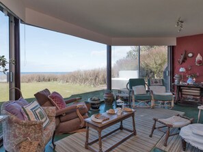 Sun room with patio doors that lead onto the garden | Bentfield, Prestwick