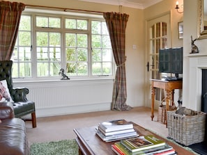 Cosy living room with open fire | Tickton Hall - Tickton Hall Cottage - Tickton Hall Cottages, Beverley