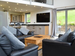 Relaxing open plan living space with wood burner and 65” Freeview TV | Heartwell Cottage - Bowlees Holiday Cottages, Wolsingham, near Stanhope