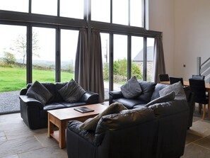 Comfortable lounge with wood burner and 65” Freeview TV | Heartwell Cottage - Bowlees Holiday Cottages, Wolsingham, near Stanhope