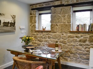 Dining area with exposed stone feature wall | Fisherman’s Nook, Dartmeet, near Yelverton