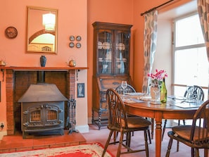 Dining room with large woodburner | Shingle Cottage, Seascale, near Eskdale