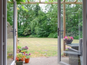 Patio doors to garden | Oakdene Lodge, Wimborne