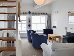 Charming living area with paddle staircase to second floor | Beach Corner Cottage, Gorran Haven, near St Austell