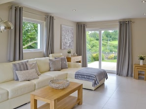 Lounge area with French doors to garden | Honey Pippin - Horselake Farm Cottages, Cheriton Bishop