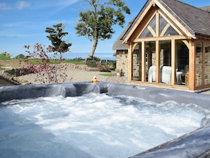 Relax in the sumptuous private hot tub | Soar Cottage, Dihewyd, near Aberaeron
