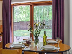 Dining area with French doors | Squirrel Cottage, North Kessock