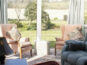 Light and airy sunroom area of living room | Dairy Cottage, Barnstaple