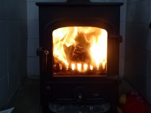 Warming log burner within the living room | Southview, Porchfield, near Newport