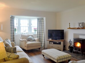 Warm, cosy living room | Raglan Cottage, Ardentinny, near Dunoon