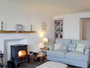 Warm, inviting living room | Raglan Cottage, Ardentinny, near Dunoon