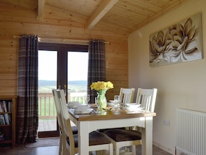 Lovely dining area with views to the surrounding countryside | Callow Lodge, Bromlow, near Minsterley