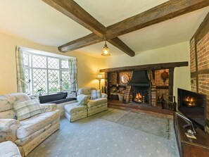 Welcoming living room with open fire | Manor Cottage, Eckington, near Pershore