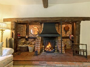 Welcoming living room with open fire | Manor Cottage, Eckington, near Pershore