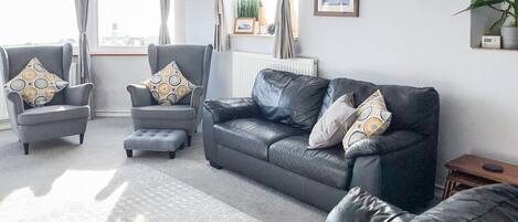 Light and airy living room with sea views | Lloyds Cottage, Portland, near Weymouth