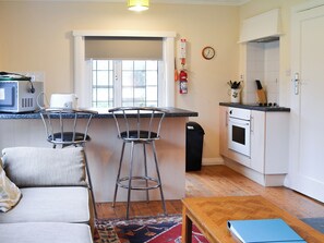 Cosy kitchen area with breakfast bar | Birch, Llanddona, near Beaumaris