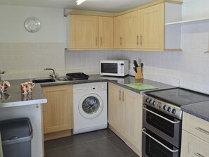 Well-equipped fitted kitchen | The Bridge Inn Apartment, Bridgerule, near Bude